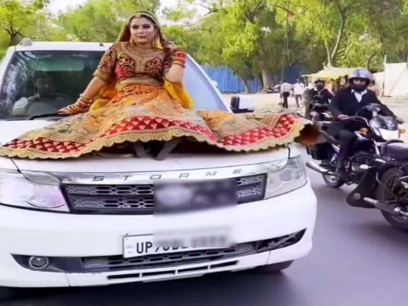 Viral Video : सड़क पर चलती एसयूवी के बोनट पर बैठी दुल्हन, 15 सेकंड की रील के बदले 15500 रुपये का कटा चालान 