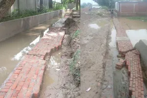 बहराइच: पहली ही बारिश में खुली भ्रष्टाचार की खुली पोल, ढह गई दो माह पूर्व लाखों की लागत से बनी नाले की दीवार