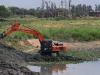 अयोध्या: सभासदों की मांग पर गोसाईगंज नगर पंचायत ने तमसा नदी में सफाई के लिये उतारी मशीन