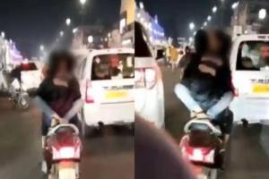 राजधानी में बीच सड़क चलती स्कूटी पर लड़की से रोमांस करने वाला गिरफ्तार, Video हुआ था Viral